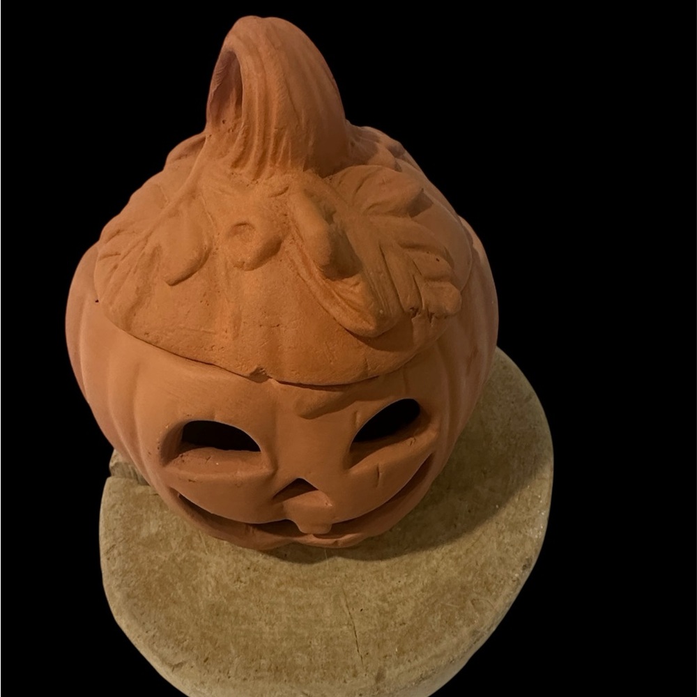Small Terracotta Pumpkin Candle Holder I see one small chip.